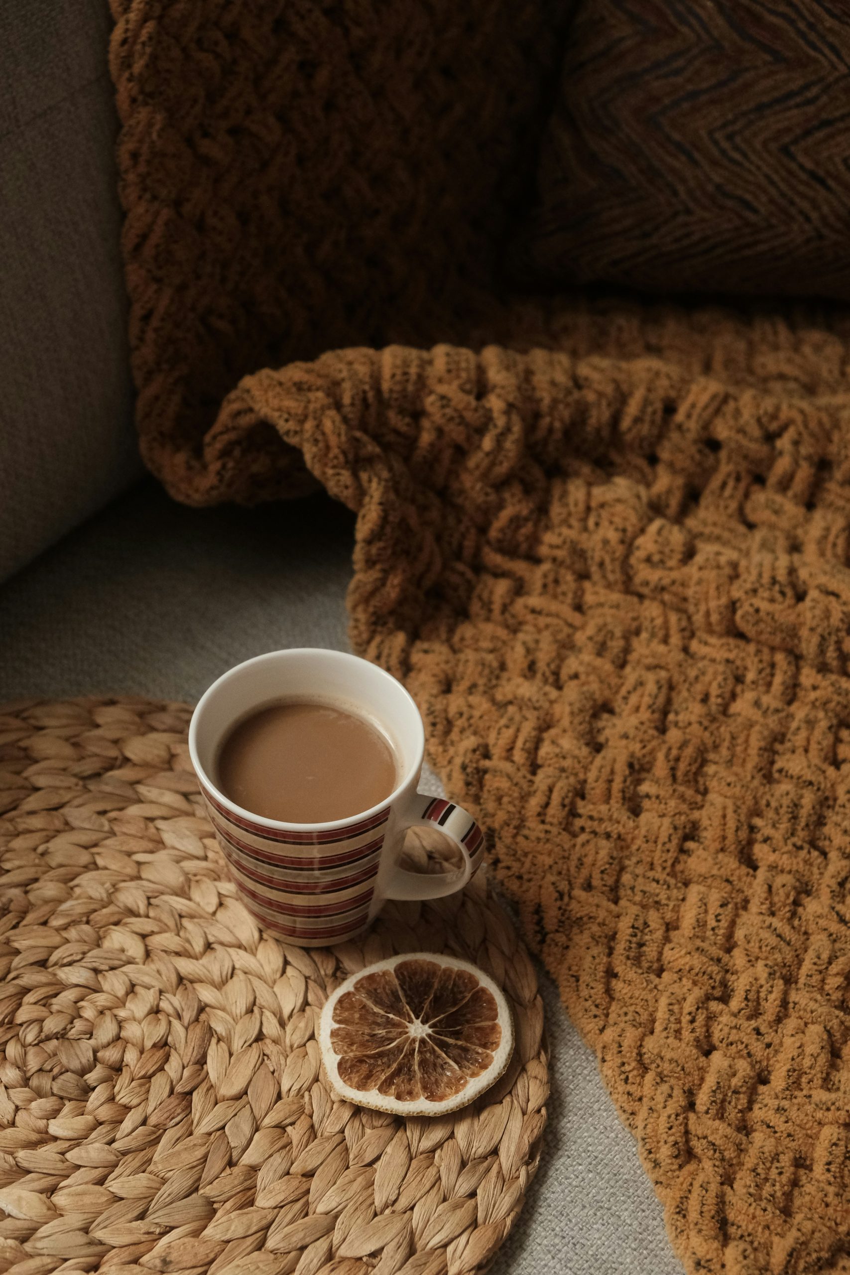 A cozy morning scene with a cup of coffee on a woven mat—natural light and peaceful textures create a calm workspace vibe.